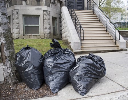 Employees engaging in sustainable waste management practices