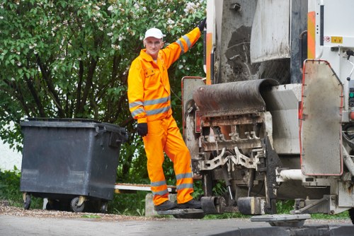 Commercial waste collection vehicle at premises